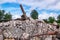 Fragments of white brick ruins, remnants of an old iron structure from a dismantled water tower