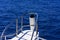 Fragments of a white yacht in the bay of the Red Sea against the blue sky of old high coral reefs