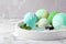 Fragrant bath bombs, oil and mint on white marble table