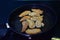 Fragrant fresh dumplings fried on a hot pan in kitchen