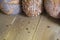 Fragrant Golden and crunchy bread on a wooden table