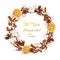 Fragrant natural wreath decorated with dried orange fruits, cotton flowers, cinnamon, anise, rosehip berries.