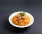 Fragrant Pilau. Pilaf, fried rice with meat and vegetables on a white plate. Isolated on gray