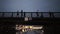 Frame from the boat in the canal, the bridge and people walking on the bridge