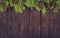 Frame from decorated Christmas tree on rustic wooden background