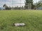 Frame of football gate, white gate net on background of a green football field