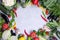 Frame of fresh organic vegetables on a gray concrete background . Healthy natural food top view, copy space .