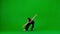 In the frame on a green background, a limp. Dances young beautiful girl. Demonstrates dance moves in the style of hip
