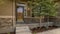 Frame Home facade with view of yard garage door porch and front door on a sunny day