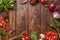 Frame made of fresh aromatic herbs, spices and vegetables on wooden background