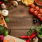 Frame made of vegetables, pizza, sushi rolls, tomato, pasta, olives and sauce on wooden background. Food concept for menu. Flat la