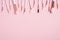 Frame of makeup brushes on pink background. Flat lay, top view. Make up shop banner mockup