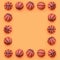 Frame of a many small orange balls for basketball sport game lies on texture background of fashion pastel orange color paper in