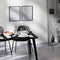 Frame mock up in contemporary minimalist design interior, close up of dining table with chairs, white wall and concrete floor,