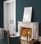 Frame mockup in dark classic interior with burning fireplace