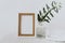 Frame mockup, olive branch in glass bottle, pitcher, styled minimalist clean image