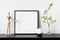 Frame mockup. Poster with plant in vase, candle and wooden human