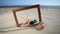 Frame with seashell, starfish and sunglasses on the beach