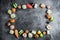 Frame with set of Japanese food on dark background. Sushi rolls, nigiri, salmon steak, rice and avocado. Flat lay. Top view