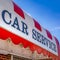 Frame Square Car Service sign on the curved awning of a commercial brick building