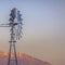 Frame Square Windpump with a rugged golden mountain and cloudy sky background