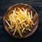 Frame Tempting french fries elegantly presented on a wooden plate