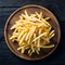 Frame Tempting french fries elegantly presented on a wooden plate