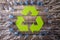 Frame of used plastic bottles with recycling symbol on wooden background. Recycle concept