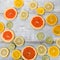 Frame of various citrus fruits and marguerite flower on white background,top view