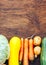 Frame of Vegetables still life in wooden background with copy space top view flatlay broccoli yellow squash potatoes carrots