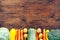 Frame of Vegetables still life in wooden background with copy space top view flatlay broccoli yellow squash potatoes carrots