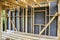 Frame of a wall and a ceiling of a wooden house, vapor barrier