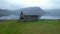 A Frame Wooden Cabin in West Fjords Iceland Drone Starts in Window