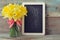 Framed blackboard with daffodils