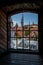 Framed cityscape view of Tallinn, Estonia looking through medieval tower stone