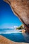 Framed by giant bizarre shaped granite rock boulders at the famous Anse Source d`Argent beach on island La Digue in