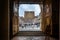 Framed view of Place Saint Vincent from inside the Cathedral in Chalon sur Saone, Burgundy, France