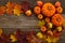 Framework with pumpkins and fall leaves on wooden background. Top view.