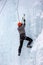 France, Bessans - January 27, 2019: Training athletes at the winter ice climbing wall.