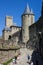 France, Carcassonne- AUGUST 28, 2014. Powerful fortifications and bastions of Carcassonne Castle. Beautiful conical blue roofs of