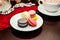 France dessert macaroons and cup cappuccino on table in cafe.