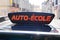 France driving school in france panel on car roof with text french auto ecole