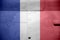 France flag depicted on side part of military armored helicopter closeup. Army forces aircraft conceptual background