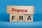 France and FRA symbol. Concept words France and FRA on wooden blocks.