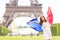 France - french flag woman by Eiffel tower, Paris