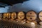 France Lyon 2019-06-21 rows giant wooden barrels, aging, fermentation, storage in Brocard wine cellar, black and white floor.