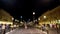 France, Nice - June, 2019: City square with tram tracks and people walking at night. Action. Beautiful old town with