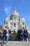 France, Paris - May 2023 - The Basilica de Sacred Heart in Montmartre and blue sky behind