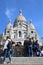 France, Paris - May 2023 - The Basilica de Sacred Heart in Montmartre and blue sky behind