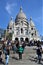 France, Paris - May 2023 - The Basilica de Sacred Heart in Montmartre and blue sky behind